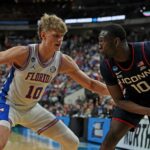 Florida's Thomas Haugh defends a UConn player.