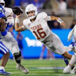 Arch Manning attempts a pass against Kentucky.